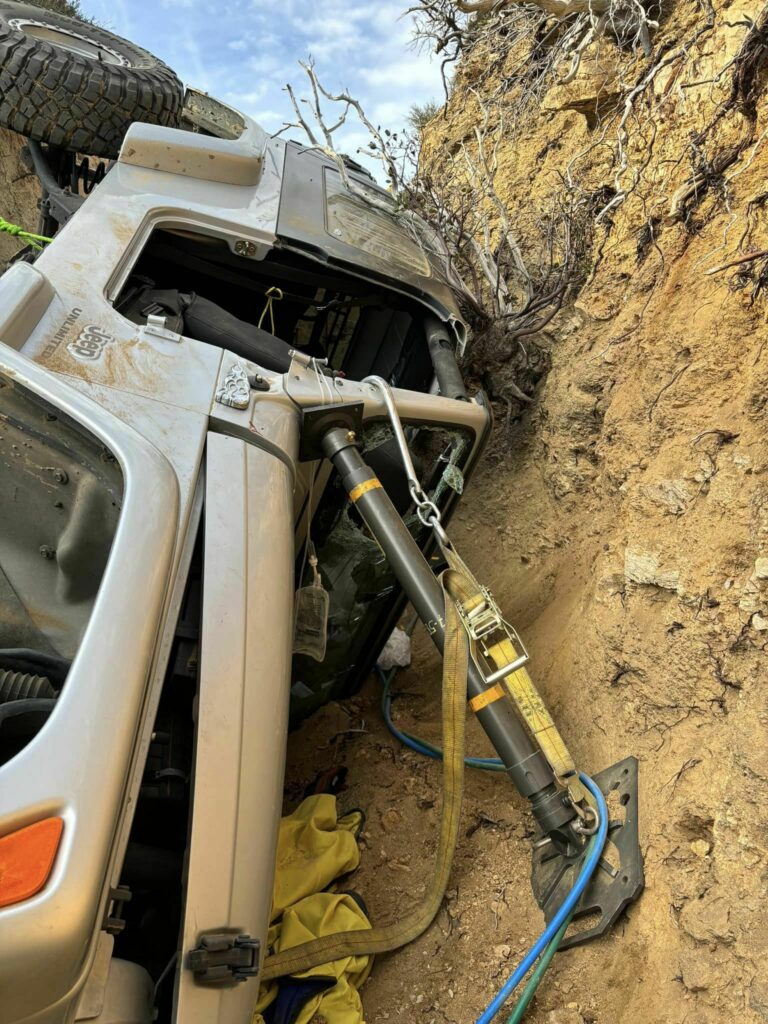  Jeep Takes A Tumble And Traps Driver On Remote Off-Road Trail Sparking Rescue