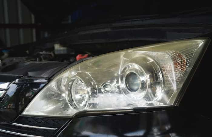 Why do vehicle headlights lenses grow to be cloudy